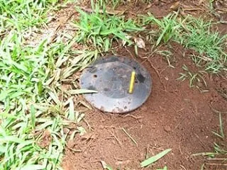 In-ground termite baiting stations installed around a property
