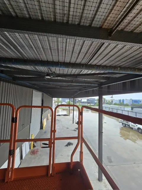 Bird netting installed under a commercial canopy