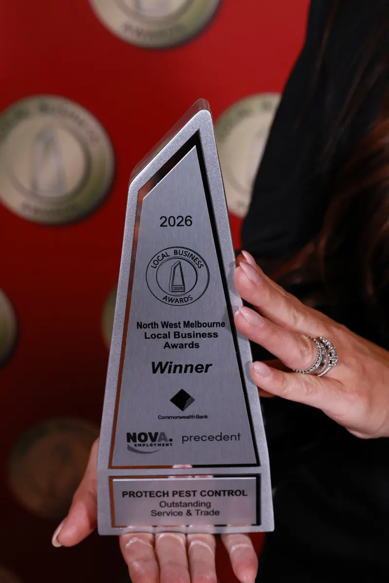 Close-up of the 2026 North West Melbourne Local Business Awards winner trophy engraved Protech Pest Control, Outstanding Service and Trade
