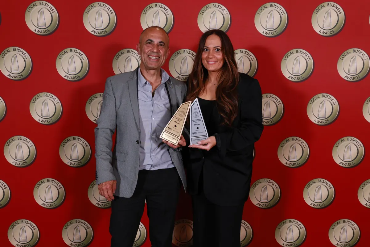Muzi Tsolakis and Reiannan Nikolaidis of Protech Pest Control holding both 2026 North West Melbourne Local Business Awards winner trophies